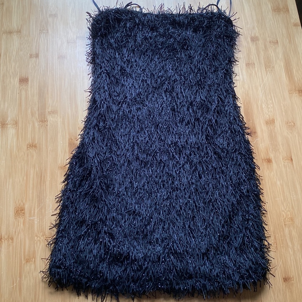 It’s that cute, little black dress.  NWT, form fitting.